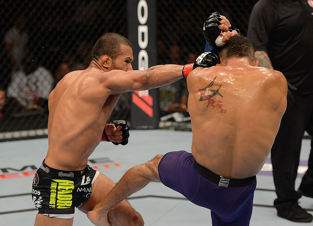 LAS VEGAS, NV - JULY 7:   (L-R) Ivan Menjivar punches Mike Easton during their bantamweight bout at UFC 148 inside MGM Grand Garden Arena on July 7, 2012 in Las Vegas, Nevada.  (Photo by Donald Miralle/Zuffa LLC/Zuffa LLC via Getty Images)  *** Local Caption *** Ivan Menjivar; Mike Easton