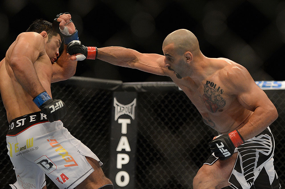 LAS VEGAS, NV - JULY 7:   (R-L) Costa Philippou punches Riki Fukuda during their middleweight bout at UFC 148 inside MGM Grand Garden Arena on July 7, 2012 in Las Vegas, Nevada.  (Photo by Josh Hedges/Zuffa LLC/Zuffa LLC via Getty Images)  *** Local Caption *** Constantinos Philippou; Riki Fukuda