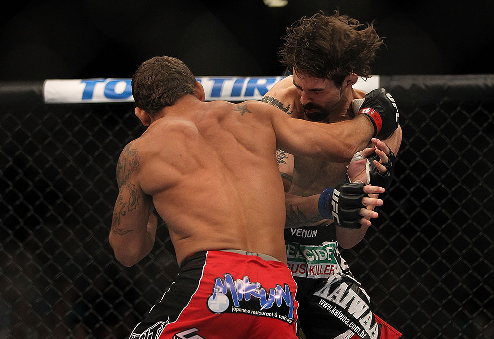 LAS VEGAS, NV - JULY 7:   (L-R) Chad Mendes punches Cody McKenzie during their featherweight bout at UFC 148 inside MGM Grand Garden Arena on July 7, 2012 in Las Vegas, Nevada. (Photo by Josh Hedges/Zuffa LLC/Zuffa LLC via Getty Images)  *** Local Caption *** Chad Mendes; Cody McKenzie