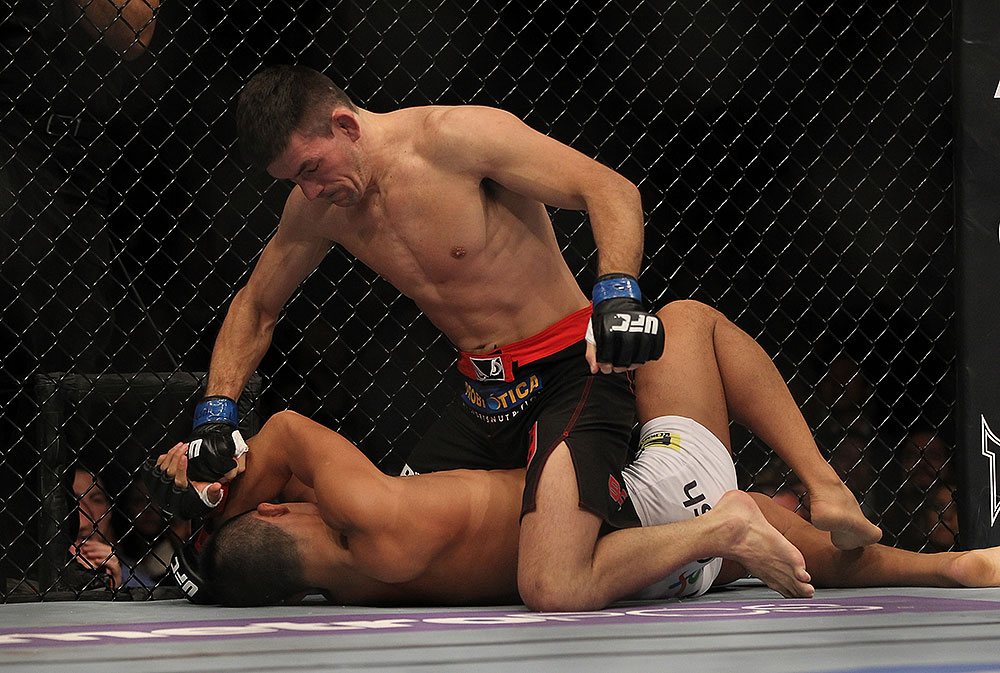 LAS VEGAS, NV - JULY 7:   Demian Maia (top) punches Dong Hyun Kim during their welterweight bout at UFC 148 inside MGM Grand Garden Arena on July 7, 2012 in Las Vegas, Nevada.  (Photo by Josh Hedges/Zuffa LLC/Zuffa LLC via Getty Images)  *** Local Caption *** Demian Maia; Dong Hyun Kim