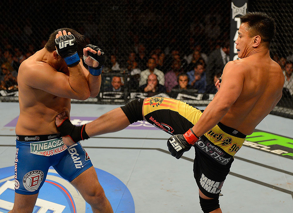 LAS VEGAS, NV - JULY 7:   (R-L) Cung Le kicks Patrick Cote during their middleweight bout at UFC 148 inside MGM Grand Garden Arena on July 7, 2012 in Las Vegas, Nevada.  (Photo by Donald Miralle/Zuffa LLC/Zuffa LLC via Getty Images)  *** Local Caption *** Cung Le; Patrick Cote