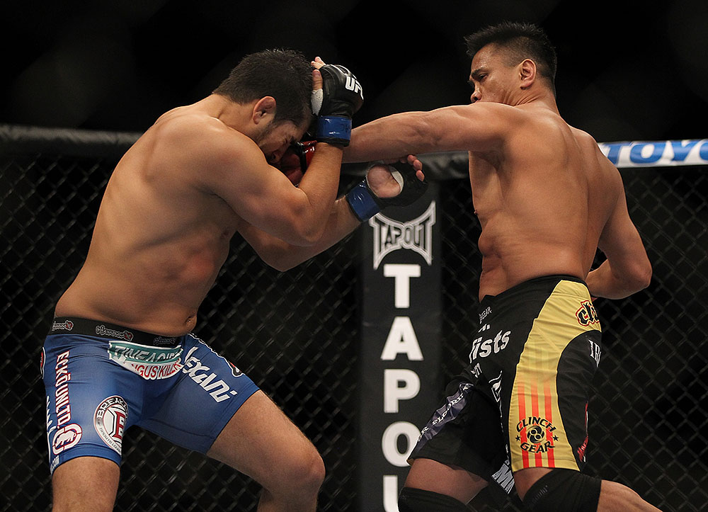 LAS VEGAS, NV - JULY 7:   (R-L) Cung Le punches Patrick Cote during their middleweight bout at UFC 148 inside MGM Grand Garden Arena on July 7, 2012 in Las Vegas, Nevada.  (Photo by Josh Hedges/Zuffa LLC/Zuffa LLC via Getty Images)  *** Local Caption *** Cung Le; Patrick Cote