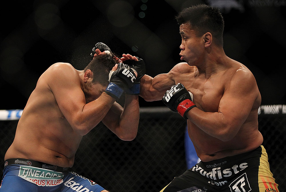 LAS VEGAS, NV - JULY 7:   (R-L) Cung Le punches Patrick Cote during their middleweight bout at UFC 148 inside MGM Grand Garden Arena on July 7, 2012 in Las Vegas, Nevada.  (Photo by Josh Hedges/Zuffa LLC/Zuffa LLC via Getty Images)  *** Local Caption *** Cung Le; Patrick Cote