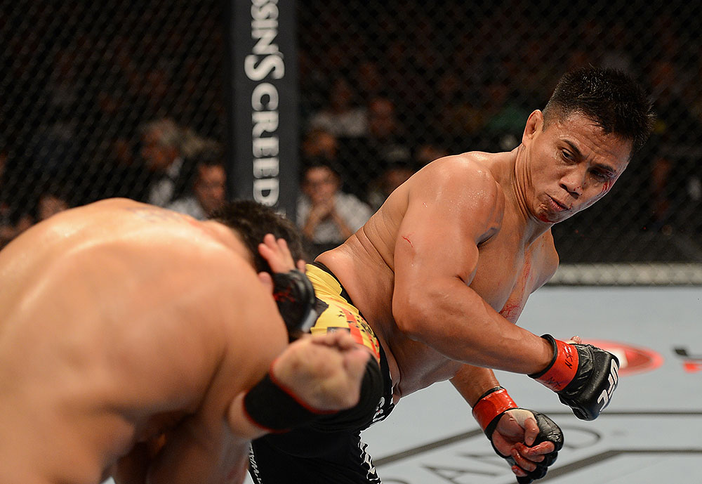 LAS VEGAS, NV - JULY 7:   Cung Le (right) kicks Patrick Cote during their middleweight bout at UFC 148 inside MGM Grand Garden Arena on July 7, 2012 in Las Vegas, Nevada.  (Photo by Donald Miralle/Zuffa LLC/Zuffa LLC via Getty Images)  *** Local Caption *** Cung Le; Patrick Cote