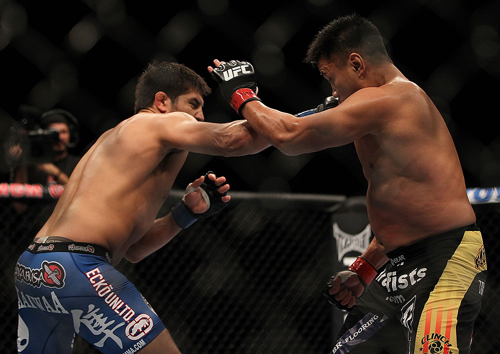 LAS VEGAS, NV - JULY 7:   (L-R) Patrick Cote punches Cung Le during their middleweight bout at UFC 148 inside MGM Grand Garden Arena on July 7, 2012 in Las Vegas, Nevada.  (Photo by Josh Hedges/Zuffa LLC/Zuffa LLC via Getty Images)  *** Local Caption *** Cung Le; Patrick Cote