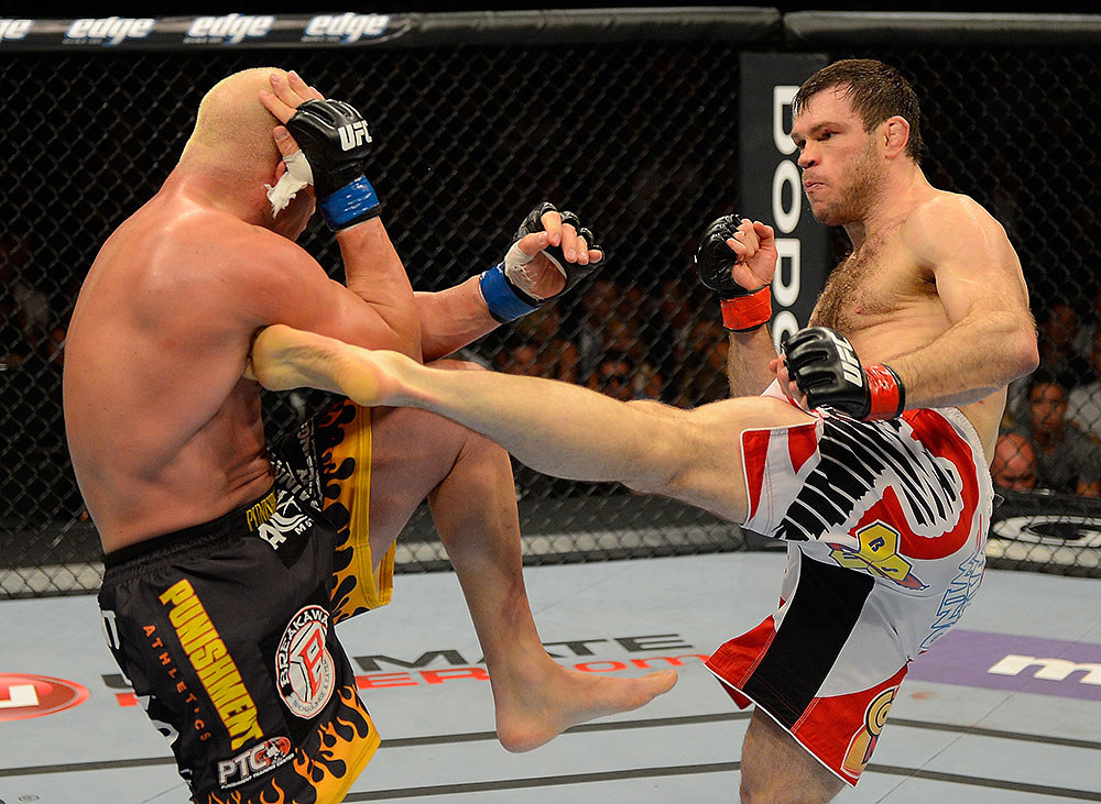 LAS VEGAS, NV - JULY 7:   (R-L) Forrest Griffin kicks Tito Ortiz during their light heavyweight bout at UFC 148 inside MGM Grand Garden Arena on July 7, 2012 in Las Vegas, Nevada.  (Photo by Donald Miralle/Zuffa LLC/Zuffa LLC via Getty Images)  *** Local Caption *** Tito Ortiz; Forrest Griffin