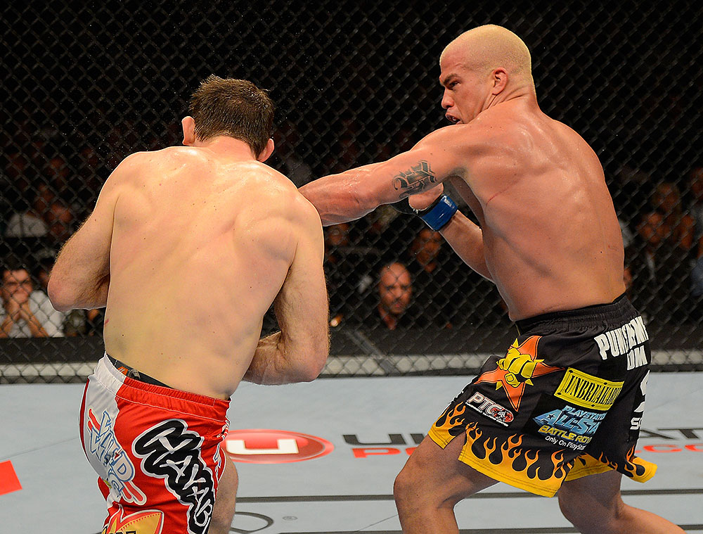 LAS VEGAS, NV - JULY 7:   (R-L) Tito Ortiz punches Forrest Griffin during their light heavyweight bout at UFC 148 inside MGM Grand Garden Arena on July 7, 2012 in Las Vegas, Nevada.  (Photo by Donald Miralle/Zuffa LLC/Zuffa LLC via Getty Images)  *** Local Caption *** Tito Ortiz; Forrest Griffin