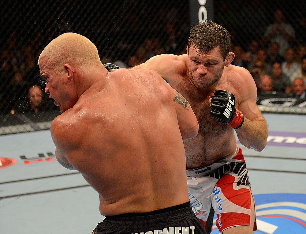 LAS VEGAS, NV - JULY 7:   (R-L) Forrest Griffin punches Tito Ortiz during their light heavyweight bout at UFC 148 inside MGM Grand Garden Arena on July 7, 2012 in Las Vegas, Nevada.  (Photo by Donald Miralle/Zuffa LLC/Zuffa LLC via Getty Images)  *** Local Caption *** Tito Ortiz; Forrest Griffin