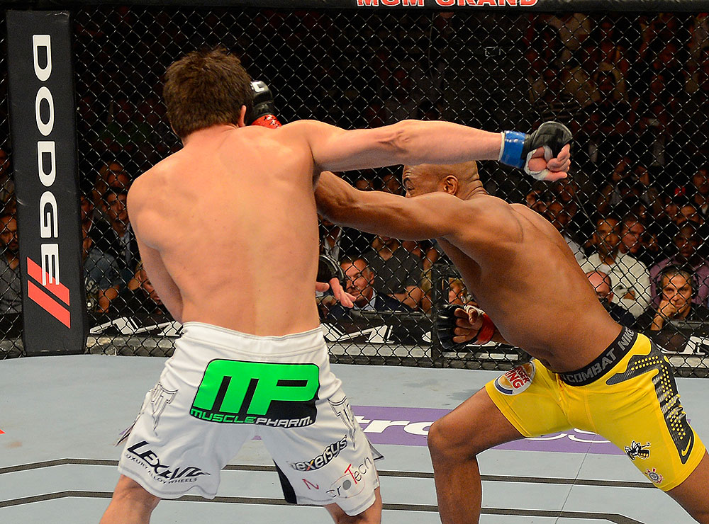 LAS VEGAS, NV - JULY 7:   (R-L) Anderson Silva punches Chael Sonnen during their UFC middleweight championship bout at UFC 148 inside MGM Grand Garden Arena on July 7, 2012 in Las Vegas, Nevada.  (Photo by Donald Miralle/Zuffa LLC/Zuffa LLC via Getty Images)  *** Local Caption *** Anderson Silva; Chael Sonnen
