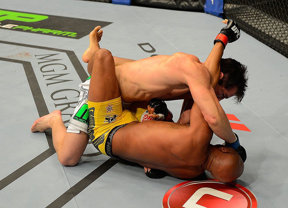 LAS VEGAS, NV - JULY 7:   Chael Sonnen (top) punches Anderson Silva during their UFC middleweight championship bout at UFC 148 inside MGM Grand Garden Arena on July 7, 2012 in Las Vegas, Nevada.  (Photo by Donald Miralle/Zuffa LLC/Zuffa LLC via Getty Images)  *** Local Caption *** Anderson Silva; Chael Sonnen