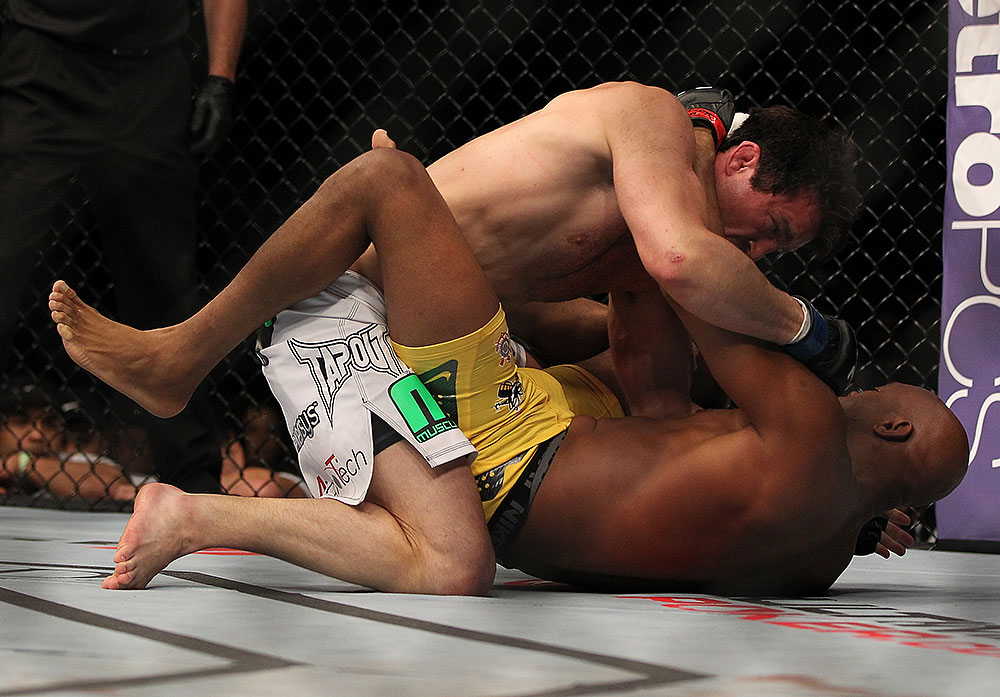 LAS VEGAS, NV - JULY 7:   Chael Sonnen (top) punches Anderson Silva during their UFC middleweight championship bout at UFC 148 inside MGM Grand Garden Arena on July 7, 2012 in Las Vegas, Nevada.  (Photo by Josh Hedges/Zuffa LLC/Zuffa LLC via Getty Images)  *** Local Caption *** Anderson Silva; Chael Sonnen