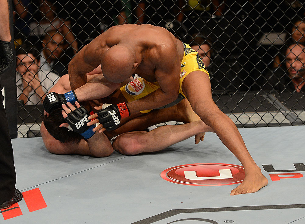 LAS VEGAS, NV - JULY 7:   (R-L) Anderson Silva punches Chael Sonnen during their UFC middleweight championship bout at UFC 148 inside MGM Grand Garden Arena on July 7, 2012 in Las Vegas, Nevada.  (Photo by Donald Miralle/Zuffa LLC/Zuffa LLC via Getty Images)  *** Local Caption *** Anderson Silva; Chael Sonnen
