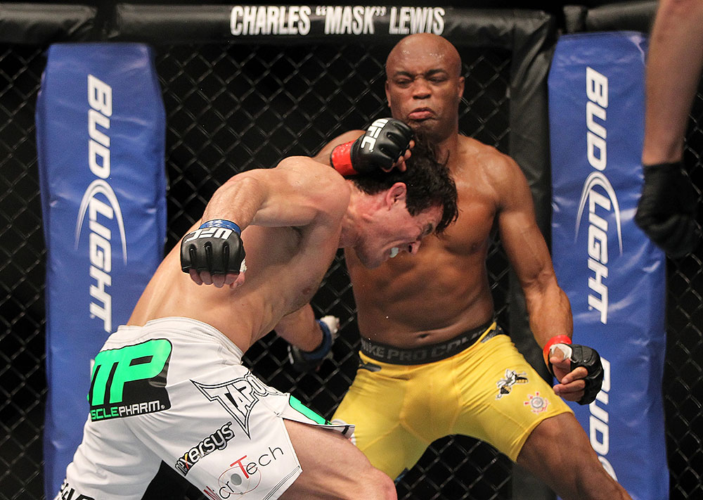 LAS VEGAS, NV - JULY 7:   Anderson Silva (right) punches Chael Sonnen during their UFC middleweight championship bout at UFC 148 inside MGM Grand Garden Arena on July 7, 2012 in Las Vegas, Nevada.  (Photo by Josh Hedges/Zuffa LLC/Zuffa LLC via Getty Images)  *** Local Caption *** Anderson Silva; Chael Sonnen