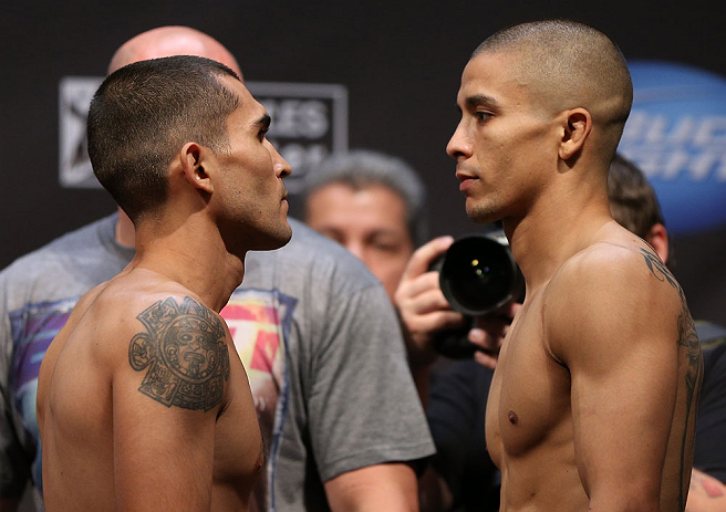 LOS ANGELES - AUGUST 03: (L-R) Opponents Ulysses Gomez and John Moraga face off during the UFC on FOX weigh in at Staples Center on August 3, 2012 in Los Angeles, California. (Photo by Josh Hedges/Zuffa LLC/Zuffa LLC via Getty Images)
