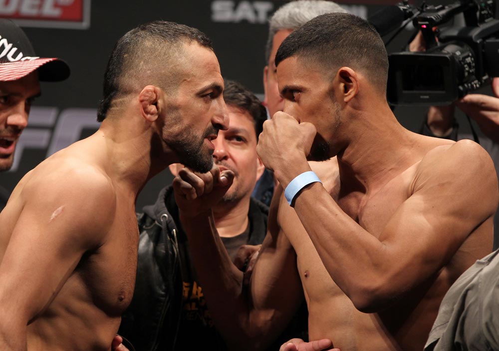 STOCKHOLM, SWEDEN - APRIL 13: (L-R) Lightweight opponents Reza Madadi and Yoislandy Izquierdo face off after weighing during the official UFC on Fuel TV weigh in event at Ericsson Globe on April 13, 2012 in Stockholm, Sweden. (Photo by Josh Hedges/Zuffa LLC/Zuffa LLC via Getty Images)