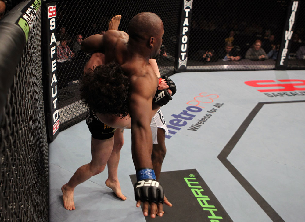 NASHVILLE, TN - JANUARY 20:  (L-R) Charlie Brenneman takes down Daniel Roberts during the UFC on FX event at Bridgestone Arena on January 20, 2012 in Nashville, Tennessee.  (Photo by Josh Hedges/Zuffa LLC/Zuffa LLC via Getty Images)