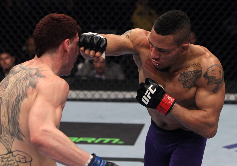 NASHVILLE, TN - JANUARY 20:  (R-L) Mike Easton punches Jared Papazian during the UFC on FX event at Bridgestone Arena on January 20, 2012 in Nashville, Tennessee.  (Photo by Josh Hedges/Zuffa LLC/Zuffa LLC via Getty Images)