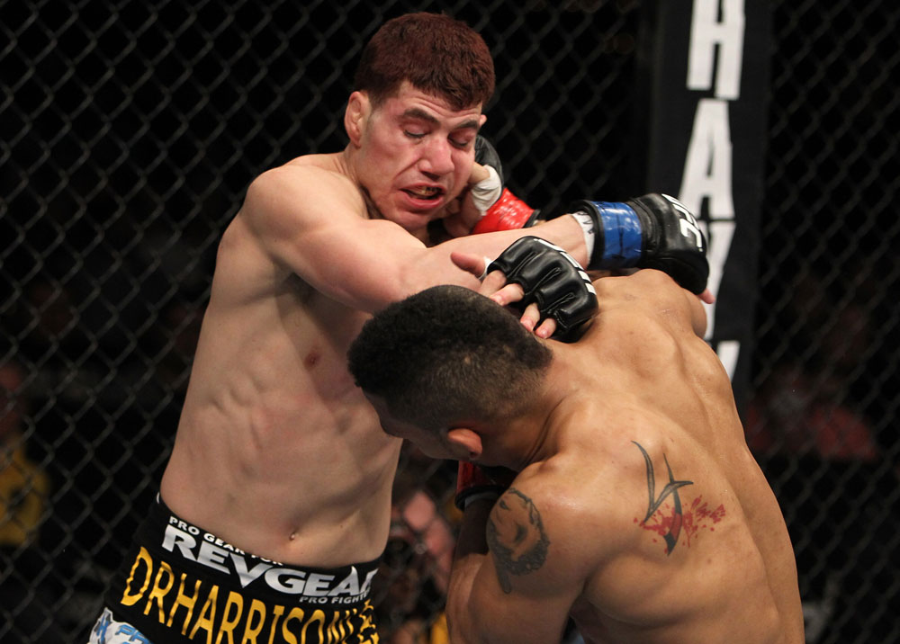 NASHVILLE, TN - JANUARY 20:  (R-L) Mike Easton and Jared Papazian trade punches during the UFC on FX event at Bridgestone Arena on January 20, 2012 in Nashville, Tennessee.  (Photo by Josh Hedges/Zuffa LLC/Zuffa LLC via Getty Images)