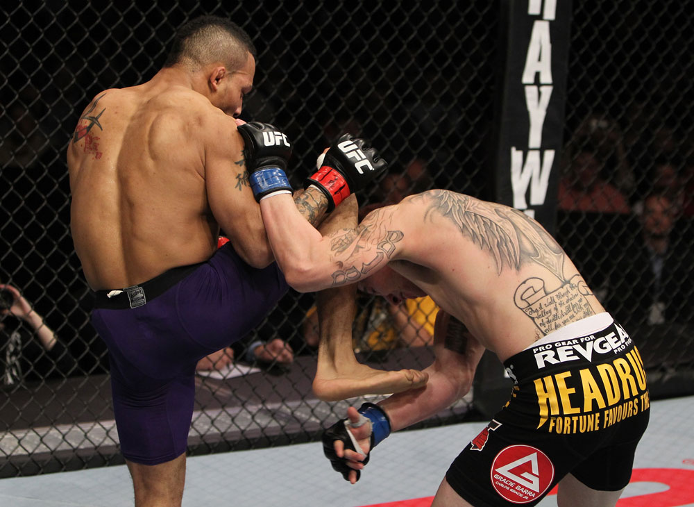 NASHVILLE, TN - JANUARY 20:  (L-R) Mike Easton delivers a knee against Jared Papazian during the UFC on FX event at Bridgestone Arena on January 20, 2012 in Nashville, Tennessee.  (Photo by Josh Hedges/Zuffa LLC/Zuffa LLC via Getty Images)
