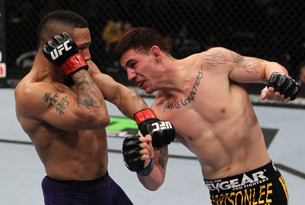 NASHVILLE, TN - JANUARY 20:  (R-L) Jared Papazian punches Mike Easton during the UFC on FX event at Bridgestone Arena on January 20, 2012 in Nashville, Tennessee.  (Photo by Josh Hedges/Zuffa LLC/Zuffa LLC via Getty Images)