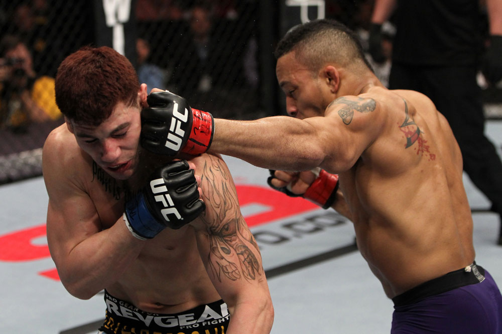 NASHVILLE, TN - JANUARY 20:  (R-L) Mike Easton punches Jared Papazian during the UFC on FX event at Bridgestone Arena on January 20, 2012 in Nashville, Tennessee.  (Photo by Josh Hedges/Zuffa LLC/Zuffa LLC via Getty Images)