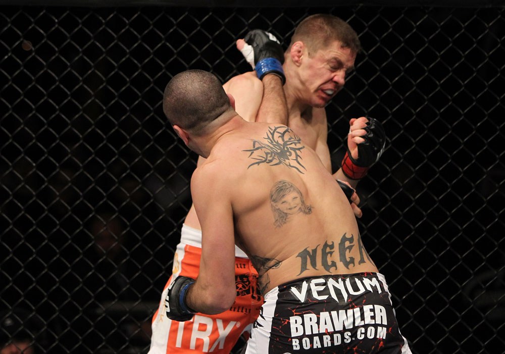 NASHVILLE, TN - JANUARY 20:  (L-R) Josh Neer punches Duane Ludwig during the UFC on FX event at Bridgestone Arena on January 20, 2012 in Nashville, Tennessee.  (Photo by Josh Hedges/Zuffa LLC/Zuffa LLC via Getty Images)