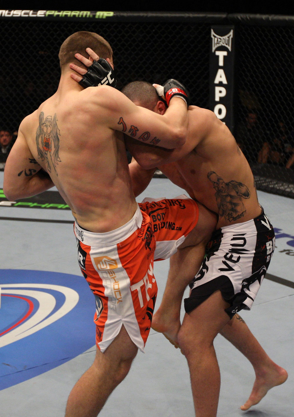 NASHVILLE, TN - JANUARY 20: (L-R) Duane Ludwig delivers a knee strike against Josh Neer during the UFC on FX event at Bridgestone Arena on January 20, 2012 in Nashville, Tennessee.  (Photo by Josh Hedges/Zuffa LLC/Zuffa LLC via Getty Images)