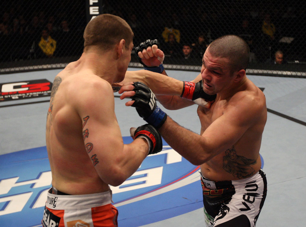 NASHVILLE, TN - JANUARY 20:  (L-R) Duane Ludwig punches Josh Neer during the UFC on FX event at Bridgestone Arena on January 20, 2012 in Nashville, Tennessee.  (Photo by Josh Hedges/Zuffa LLC/Zuffa LLC via Getty Images)