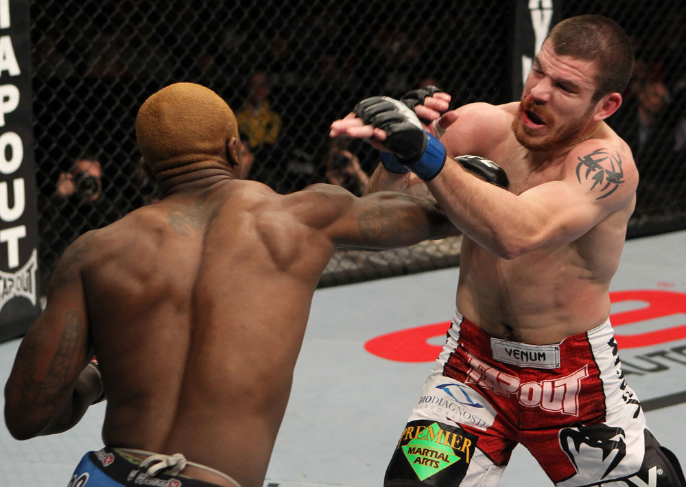 NASHVILLE, TN - JANUARY 20:  (L-R) Melvin Guillard punches Jim Miller during the UFC on FX event at Bridgestone Arena on January 20, 2012 in Nashville, Tennessee.  (Photo by Josh Hedges/Zuffa LLC/Zuffa LLC via Getty Images)