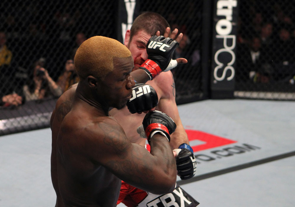 NASHVILLE, TN - JANUARY 20:  (R-L) Jim Miller punches Melvin Guillard during the UFC on FX event at Bridgestone Arena on January 20, 2012 in Nashville, Tennessee.  (Photo by Josh Hedges/Zuffa LLC/Zuffa LLC via Getty Images)