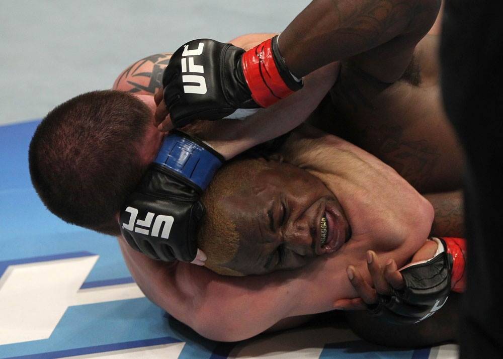 NASHVILLE, TN - JANUARY 20:  (L-R) Jim Miller secures a rear choke submission to defeat Melvin Guillard during the UFC on FX event at Bridgestone Arena on January 20, 2012 in Nashville, Tennessee.  (Photo by Josh Hedges/Zuffa LLC/Zuffa LLC via Getty Images)