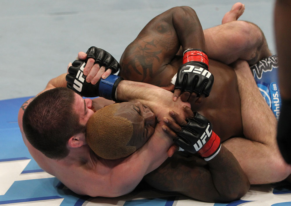 NASHVILLE, TN - JANUARY 20:  (L-R) Jim Miller secures a rear choke submission to defeat Melvin Guillard during the UFC on FX event at Bridgestone Arena on January 20, 2012 in Nashville, Tennessee.  (Photo by Josh Hedges/Zuffa LLC/Zuffa LLC via Getty Images)
