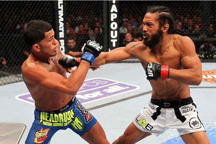 MILWAUKEE, WI - AUGUST 31:  (R-L) Benson Henderson punches Anthony Pettis in their UFC lightweight championship bout at BMO Harris Bradley Center on August 31, 2013 in Milwaukee, Wisconsin. (Photo by Ed Mulholland/Zuffa LLC/Zuffa LLC via Getty Images) *** Local Caption *** Benson Henderson; Anthony Pettis