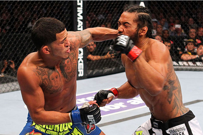 MILWAUKEE, WI - AUGUST 31:  (L-R) Anthony Pettis punches Benson Henderson in their UFC lightweight championship bout at BMO Harris Bradley Center on August 31, 2013 in Milwaukee, Wisconsin. (Photo by Ed Mulholland/Zuffa LLC/Zuffa LLC via Getty Images) *** Local Caption *** Benson Henderson; Anthony Pettis