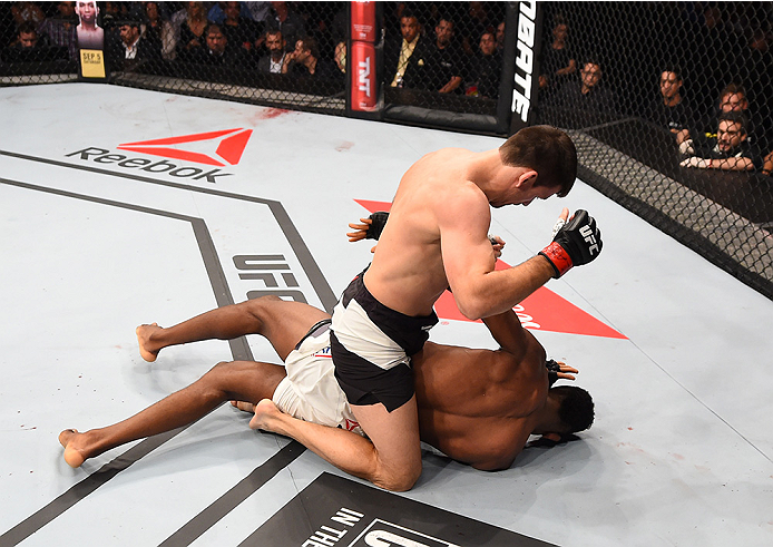 Demian Maia of Brazil (top) punches Neil Magny of the United States in their welterweight bout during UFC 190 on August 1, 2015 in Rio de Janeiro, Brazil. (Photo by Josh Hedges/Zuffa LLC)