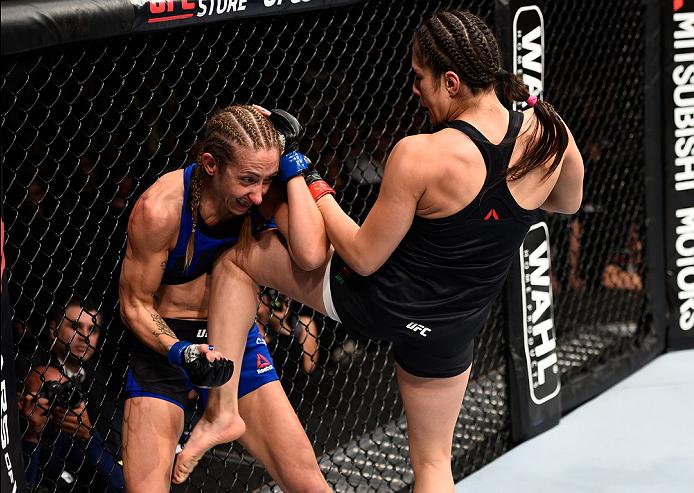 MEXICO CITY, MEXICO - NOV 05: (R-L) Alexa Grasso of Mexico knees Heather Jo Clark of the United States in their women's strawweight bout during the UFC Fight Night event at Arena Ciudad de Mexico. (Photo by Jeff Bottari/Zuffa LLC)