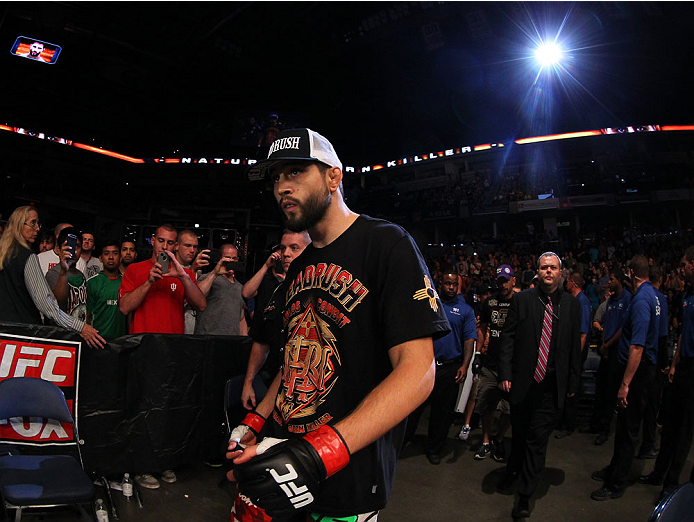 INDIANAPOLIS, IN - AUGUST 28:  Carlos Condit enters the arena before his welterweight fight against Martin Kampmann during the UFC on FOX Sports 1 event at Bankers Life Fieldhouse on August 28, 2013 in Indianapolis, Indiana. (Photo by Ed Mulholland/Zuffa LLC/Zuffa LLC via Getty Images)