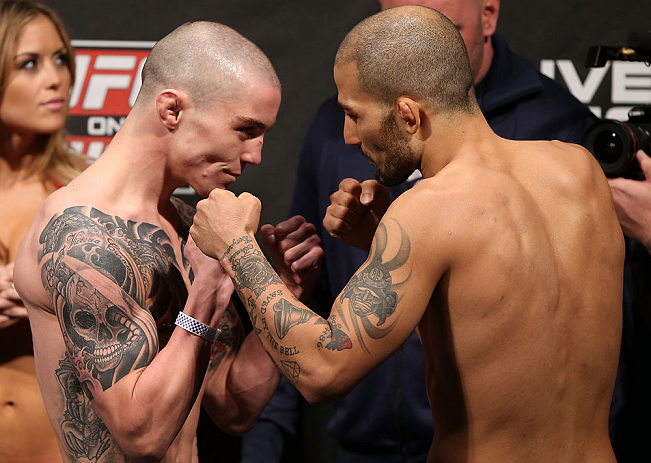 NOTTINGHAM, ENGLAND - SEPTEMBER 28: (L-R) Opponents Andy Ogle and Akira Corassani face off during the UFC on Fuel TV weigh in at Capital FM Arena on September 28, 2012 in Nottingham, England. (Photo by Josh Hedges/Zuffa LLC/Zuffa LLC via Getty Images)