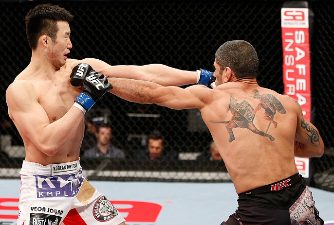 SAITAMA, JAPAN - MARCH 03:  (R-L) Marcelo Guimaraes and Hyun Gyu Lim trade punches in their welterweight fight during the UFC on FUEL TV event at Saitama Super Arena on March 3, 2013 in Saitama, Japan.  (Photo by Josh Hedges/Zuffa LLC/Zuffa LLC via Getty Images)