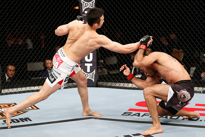 SAITAMA, JAPAN - MARCH 03:  (L-R) Hyun Gyu Lim punches Marcelo Guimaraes in their welterweight fight during the UFC on FUEL TV event at Saitama Super Arena on March 3, 2013 in Saitama, Japan.  (Photo by Josh Hedges/Zuffa LLC/Zuffa LLC via Getty Images)