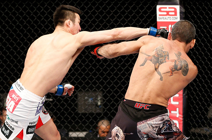 SAITAMA, JAPAN - MARCH 03:  (L-R) Hyun Gyu Lim punches Marcelo Guimaraes in their welterweight fight during the UFC on FUEL TV event at Saitama Super Arena on March 3, 2013 in Saitama, Japan.  (Photo by Josh Hedges/Zuffa LLC/Zuffa LLC via Getty Images)