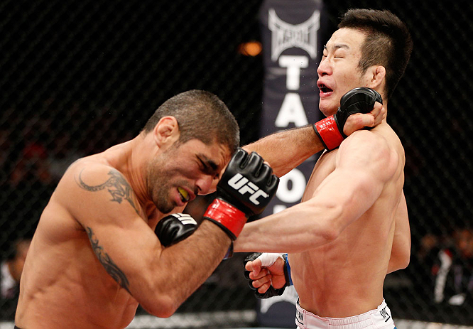SAITAMA, JAPAN - MARCH 03:  (R-L) Hyun Gyu Lim and Marcelo Guimaraes trade punches in their welterweight fight during the UFC on FUEL TV event at Saitama Super Arena on March 3, 2013 in Saitama, Japan.  (Photo by Josh Hedges/Zuffa LLC/Zuffa LLC via Getty Images)