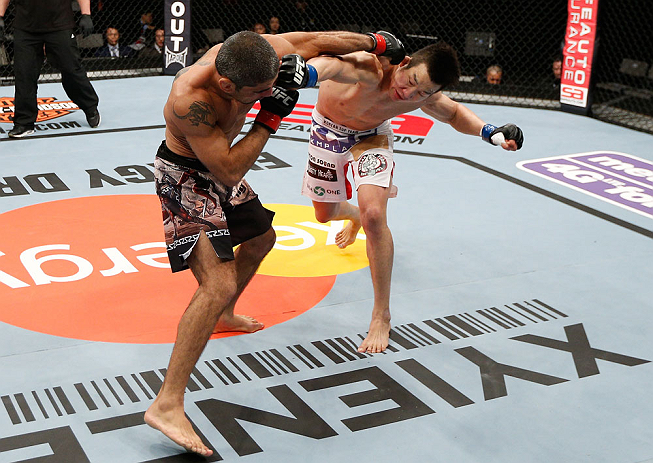 SAITAMA, JAPAN - MARCH 03:  (R-L) Hyun Gyu Lim and Marcelo Guimaraes trade punches in their welterweight fight during the UFC on FUEL TV event at Saitama Super Arena on March 3, 2013 in Saitama, Japan.  (Photo by Josh Hedges/Zuffa LLC/Zuffa LLC via Getty Images)