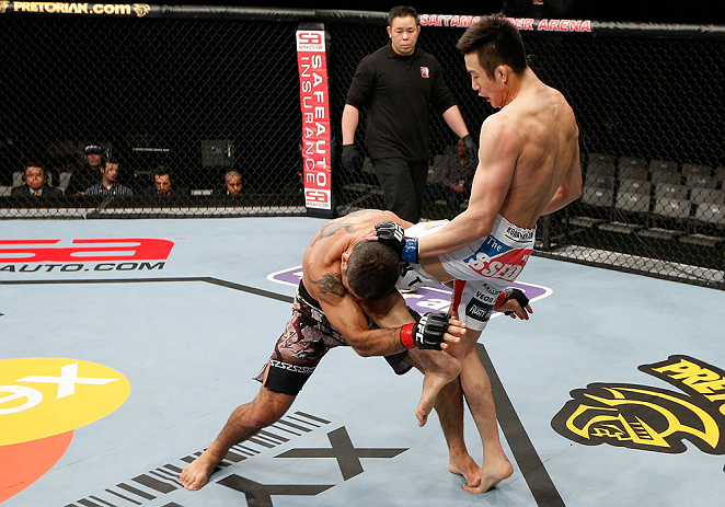 SAITAMA, JAPAN - MARCH 03:  (R-L) Hyun Gyu Lim knees Marcelo Guimaraes in their welterweight fight during the UFC on FUEL TV event at Saitama Super Arena on March 3, 2013 in Saitama, Japan.  (Photo by Josh Hedges/Zuffa LLC/Zuffa LLC via Getty Images)