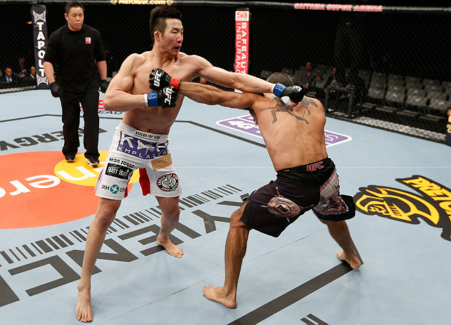 SAITAMA, JAPAN - MARCH 03:  (L-R) Hyun Gyu Lim and Marcelo Guimaraes trade punches in their welterweight fight during the UFC on FUEL TV event at Saitama Super Arena on March 3, 2013 in Saitama, Japan.  (Photo by Josh Hedges/Zuffa LLC/Zuffa LLC via Getty Images)