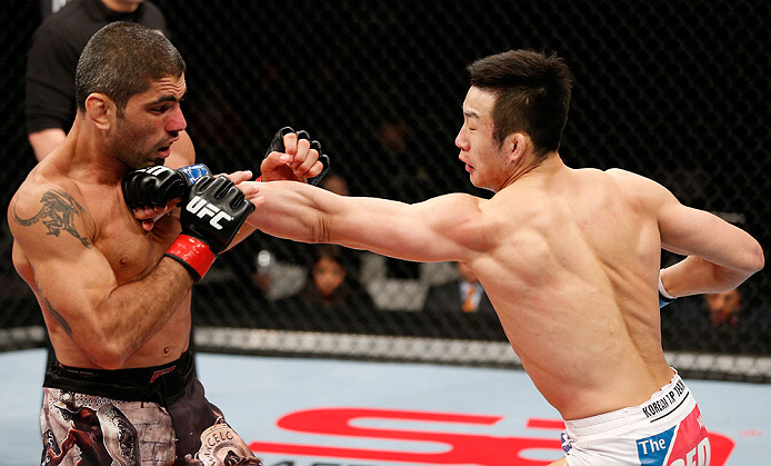 SAITAMA, JAPAN - MARCH 03:  (R-L) Hyun Gyu Lim punches Marcelo Guimaraes in their welterweight fight during the UFC on FUEL TV event at Saitama Super Arena on March 3, 2013 in Saitama, Japan.  (Photo by Josh Hedges/Zuffa LLC/Zuffa LLC via Getty Images)