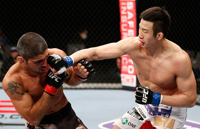 SAITAMA, JAPAN - MARCH 03:  (R-L) Hyun Gyu Lim punches Marcelo Guimaraes in their welterweight fight during the UFC on FUEL TV event at Saitama Super Arena on March 3, 2013 in Saitama, Japan.  (Photo by Josh Hedges/Zuffa LLC/Zuffa LLC via Getty Images)