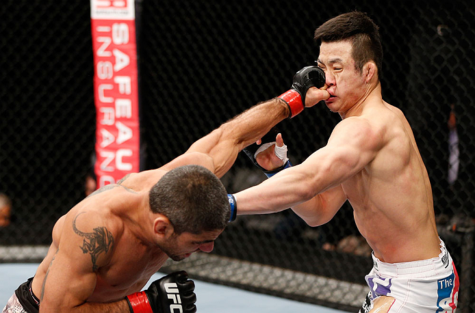 SAITAMA, JAPAN - MARCH 03:  (L-R) Marcelo Guimaraes punches Hyun Gyu Lim in their welterweight fight during the UFC on FUEL TV event at Saitama Super Arena on March 3, 2013 in Saitama, Japan.  (Photo by Josh Hedges/Zuffa LLC/Zuffa LLC via Getty Images)