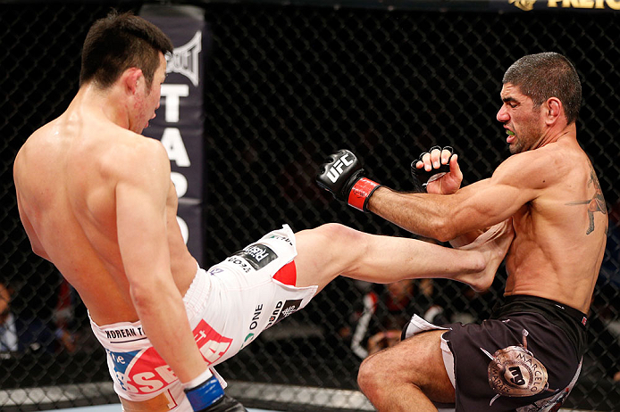 SAITAMA, JAPAN - MARCH 03:  (L-R) Hyun Gyu Lim kicks Marcelo Guimaraes in their welterweight fight during the UFC on FUEL TV event at Saitama Super Arena on March 3, 2013 in Saitama, Japan.  (Photo by Josh Hedges/Zuffa LLC/Zuffa LLC via Getty Images)