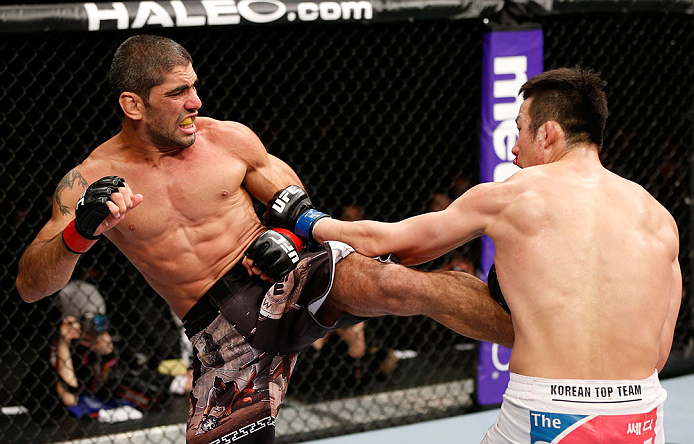SAITAMA, JAPAN - MARCH 03:  (L-R) Marcelo Guimaraes kicks Hyun Gyu Lim in their welterweight fight during the UFC on FUEL TV event at Saitama Super Arena on March 3, 2013 in Saitama, Japan.  (Photo by Josh Hedges/Zuffa LLC/Zuffa LLC via Getty Images)